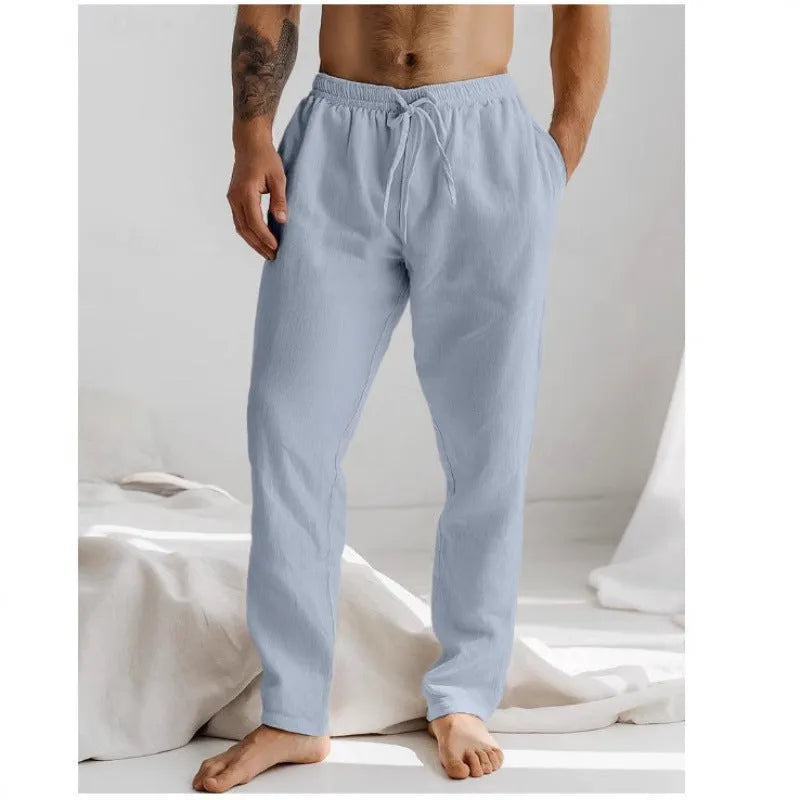 Men's light grey loose-fit summer trousers with elastic waistband and straight leg opening