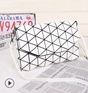 Rhombic ABS shoulder bag in envelope style, available in multiple colours including black and pink.