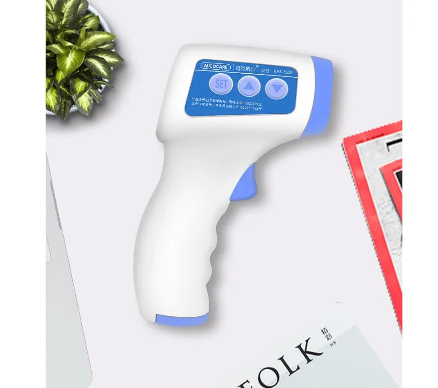 White RAK-FI03 infrared forehead thermometer held near a child's forehead showing non-contact measurement