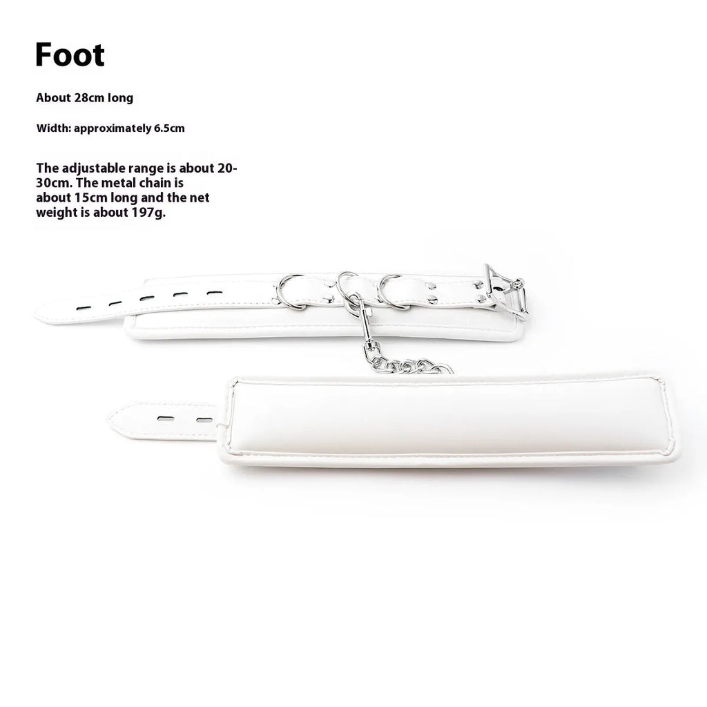 White PU sponge bondage restraint set showing handcuffs, footcuffs and neck scarf