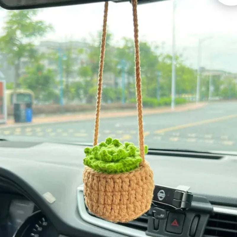 Green and white knitted rope car plant ornament with 8cm base and hanging rope.