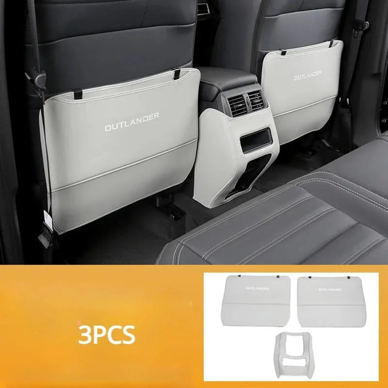Set of three leather anti-kick pads for Mitsubishi Outlander seats and console in black, grey, and brown.