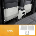 Set of three leather anti-kick pads for Mitsubishi Outlander seats and console in black, grey, and brown.