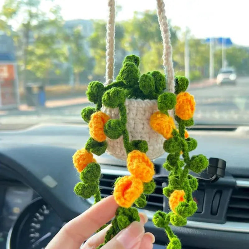 Green and white knitted rope car plant ornament with 8cm base and hanging rope.