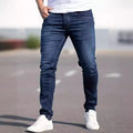 Men's dark blue slim fit casual jeans with mid waist and zipper fly opening