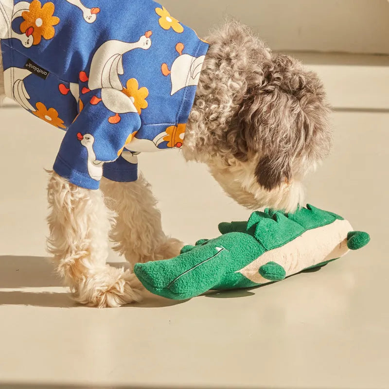 Green interactive plush dog toy with squeaker and crinkle sounds, measuring 35 cm long.