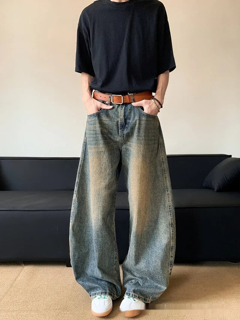 Men's retro blue distressed denim jeans with wide-leg silhouette and micro elasticity fabric