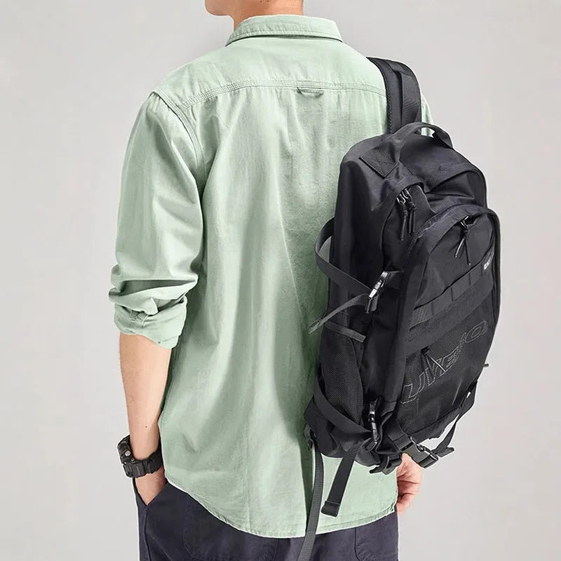 Men's light grey loose fit cardigan-style shirt with an overalls design and long sleeves.