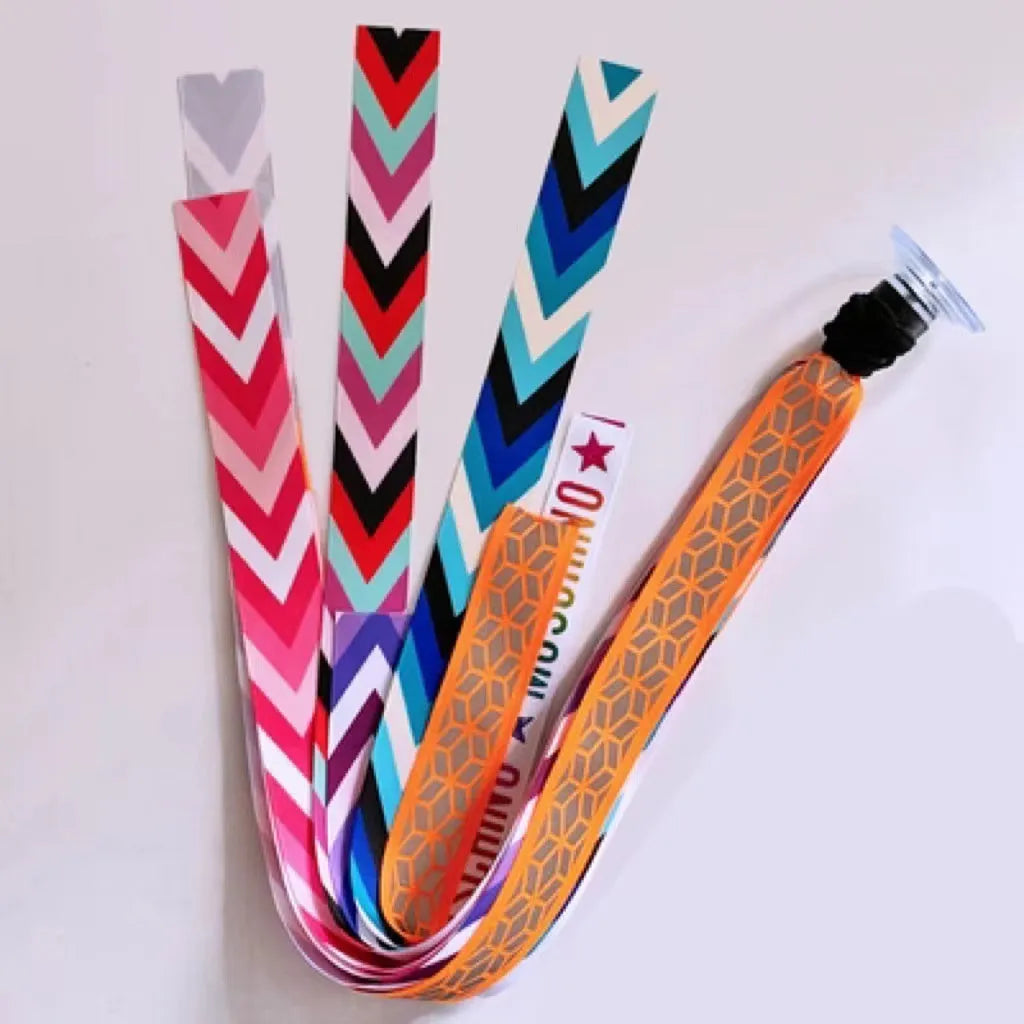 Colourful decorative ribbon streamers attached to a children safety helmet for skating or skiing