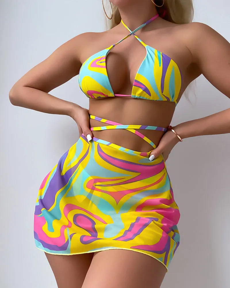 Yellow striped halter-neck swimsuit set for women with lace-up front, includes skirt and shorts