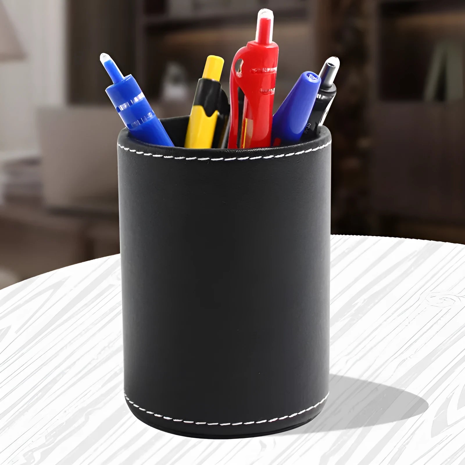 Black leather round pen holder container with 8cm diameter and 10.8cm height