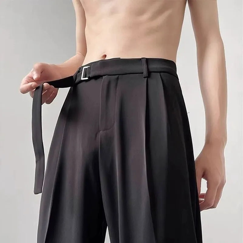Thin straight leg black wide trousers with non-ironing finish and loose fit casual style