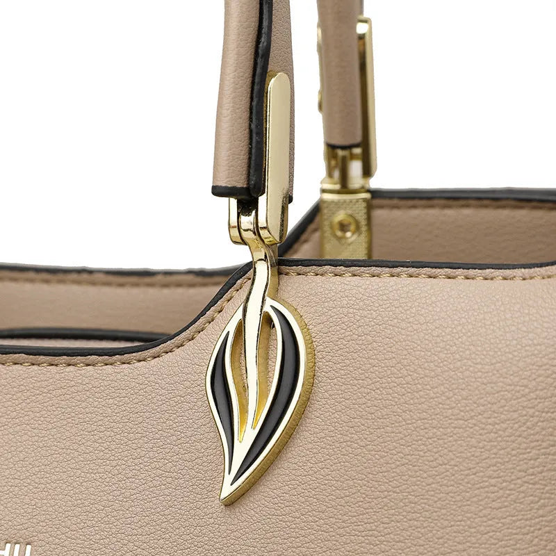 Women's black PU leather multi-compartment shoulder messenger bag with adjustable strap.