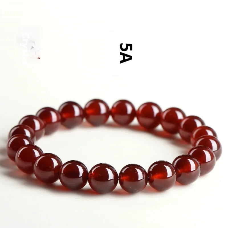 Natural orange red garnet ball crystal bracelet with Ruyi design in retro unisex style.