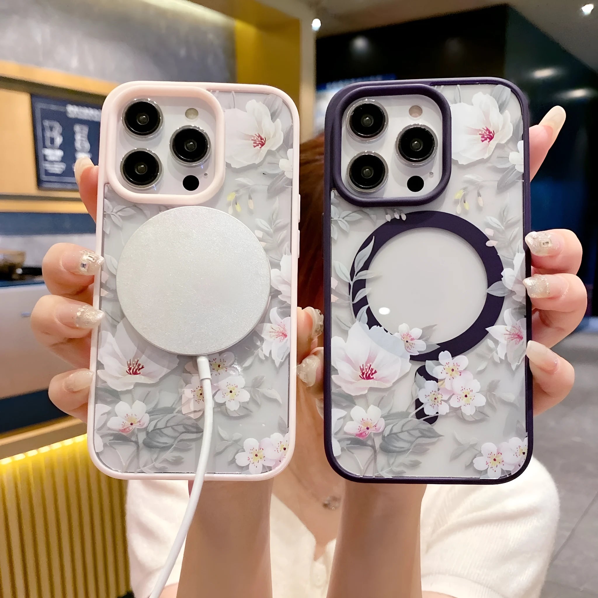 Magnetic acrylic two-in-one phone case with purple floral design on black back for iPhone