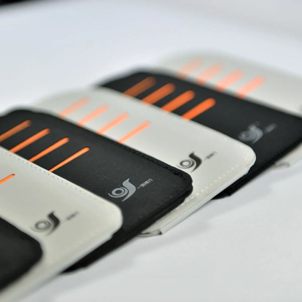 Car dashboard storage organiser with sun visor panels attached to a windscreen.