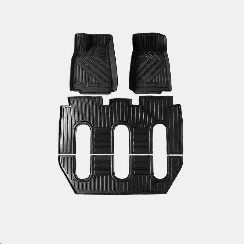 Rubber floor mat set for Tesla Model X showing foot pads and tailbox cushion for interior protection