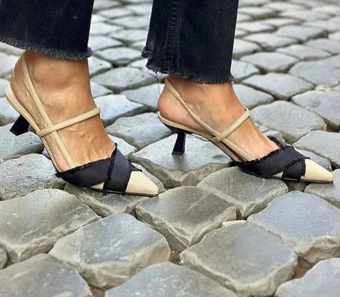 Apricot black women's pointed toe stiletto sandals with a buckle fastening.
