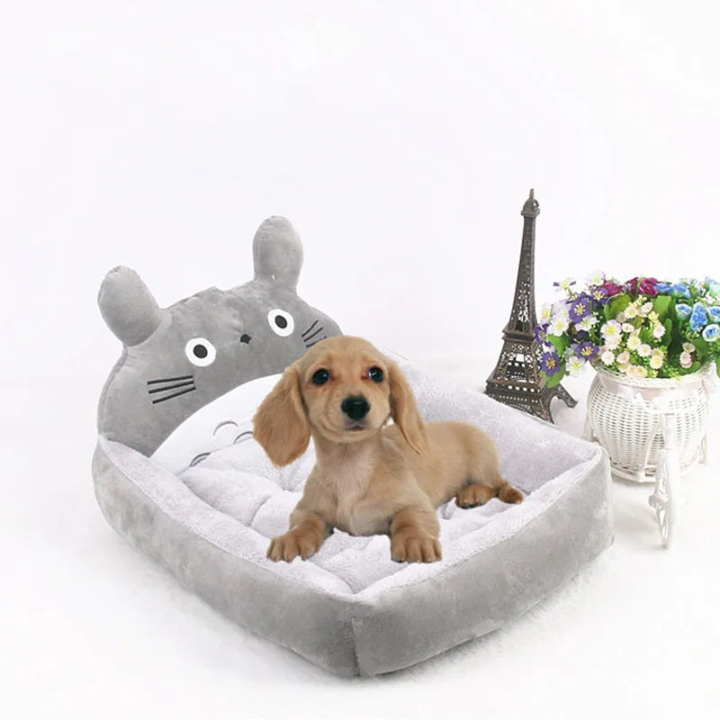 Cartoon-style pet bed for small dogs and cats with a washable cover in a choice of colours.
