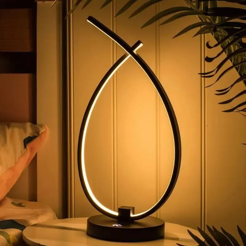 Water drop-shaped black bedside table lamp with USB charging cable