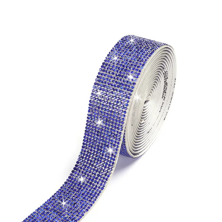 A one-yard long self-adhesive electroplated glass rhinestone strip on a roll, shown in white and AB colour variants.