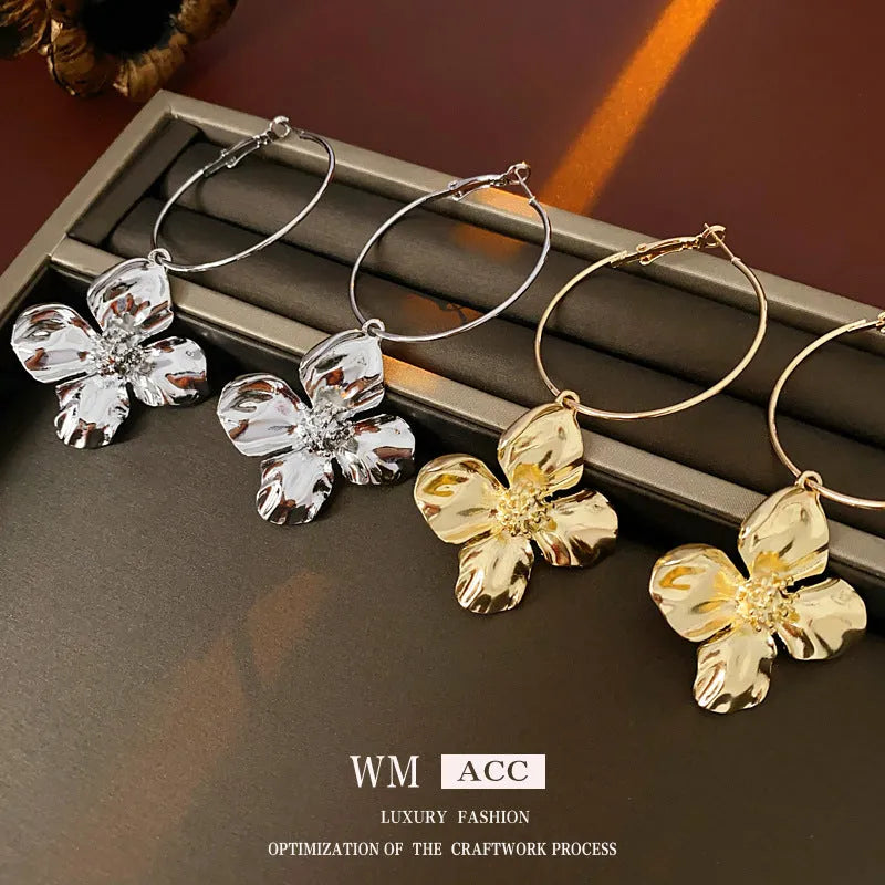 Silver needle metal flower earrings with geometric floral design in gold or silver colour