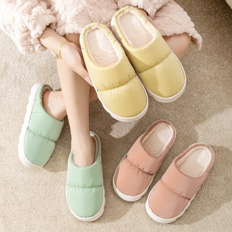 Down cotton couple slippers with artificial leather upper and non-slip rubber soles in multiple colour options
