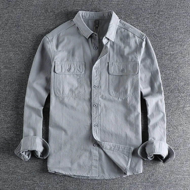 Men's light grey loose fit cardigan-style shirt with an overalls design and long sleeves.