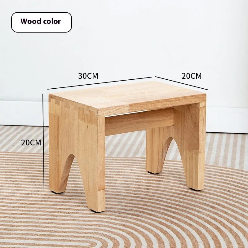 Distressed solid wood household stool with a bracket structure frame for shoe changing.