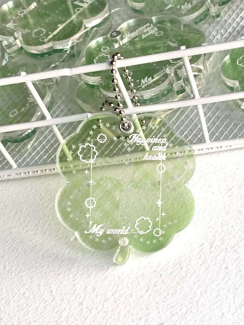 Acrylic four-leaf clover pendant keychain in blue, grass green, or mint green.
