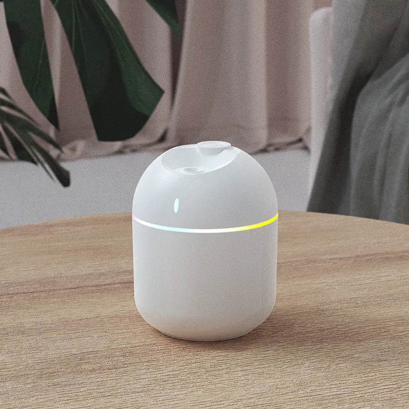 USB desktop humidifier with large spray, mute operation, and colour light in green plastic body