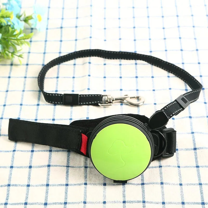 Automatic retractable dog leash extended to 3 metres, shown in vibrant orange colour with ergonomic handle.