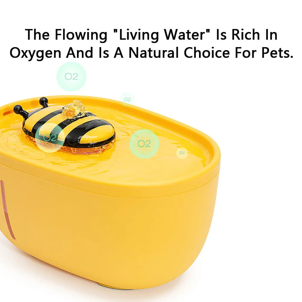 Yellow automatic cat water fountain with filter and USB cable on anti-slip base.