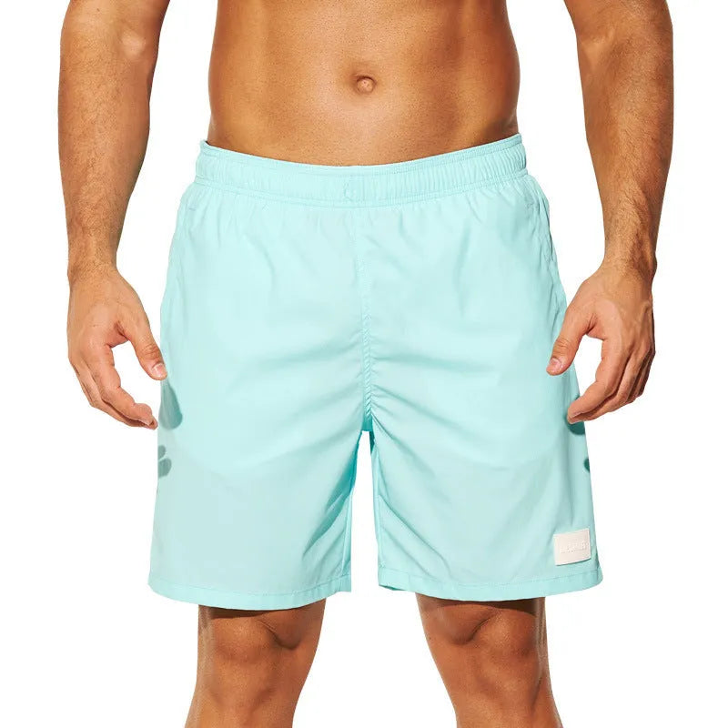 Men's solid colour quick-drying nylon sports shorts on a white background.