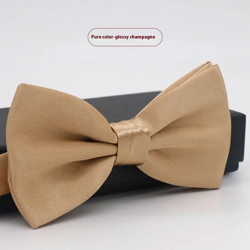 Men's flat head style polyester bow tie in a solid colour, shown with adjustable neck strap.