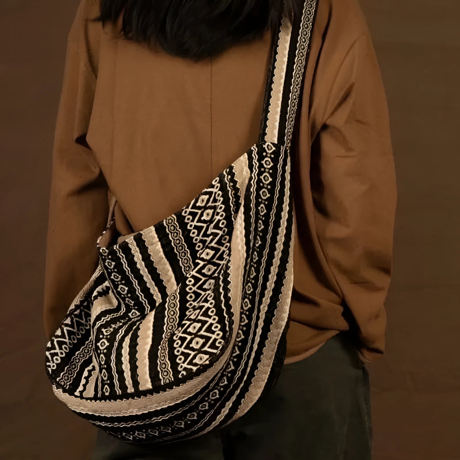 Retro striped corduroy messenger bag with vintage handprint detailing and adjustable plaid shoulder strap