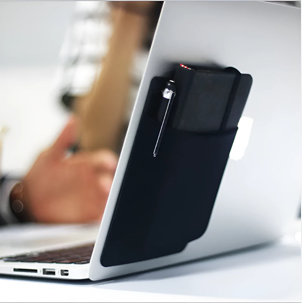 Black self-adhesive Lycra storage bag attached to back of laptop, 15x12cm, with pen loop and earphones visible
