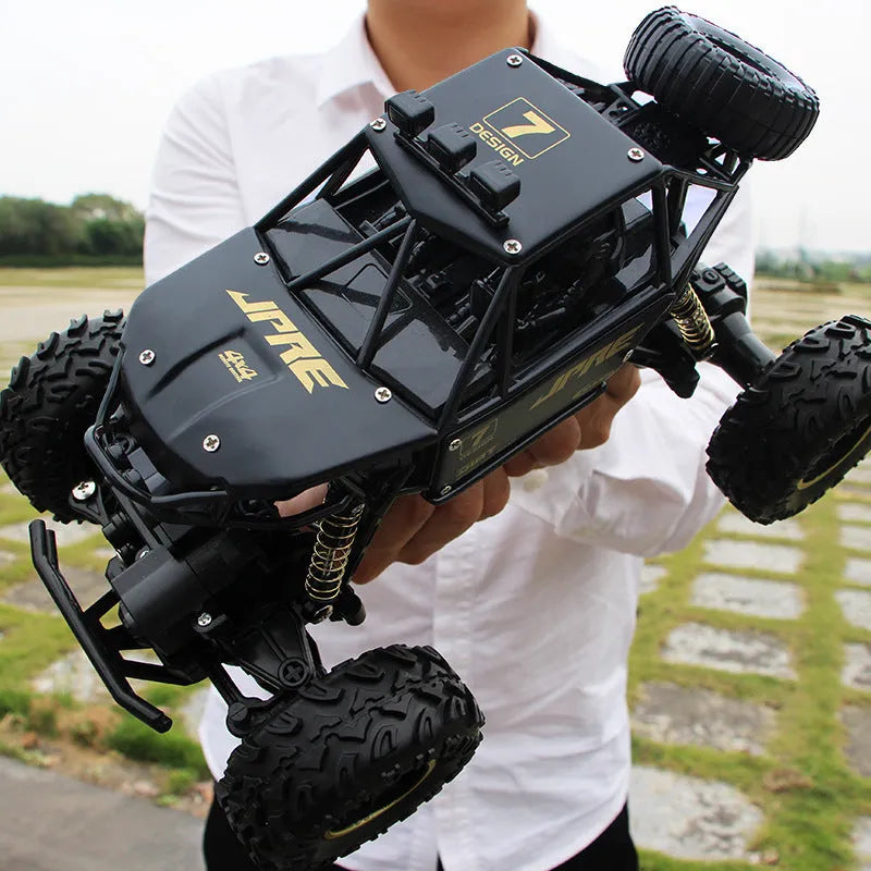 Large black 4WD remote control off-road climbing car with 2.4G wireless controller