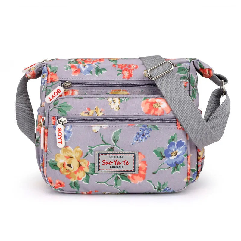 Lightweight printed nylon shoulder bag with double straps and floral or butterfly design