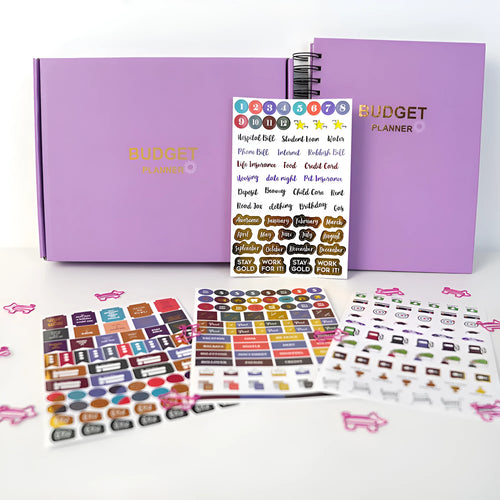A5 purple budget notebook with coil binding, stickers, pen, and paper clips for financial planning