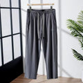 Men's ice silk thin breathable quick-drying casual pants in black, loose straight-leg style with drawstring waist