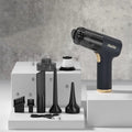 Black wireless car vacuum cleaner with multiple attachments including brushes and nozzles