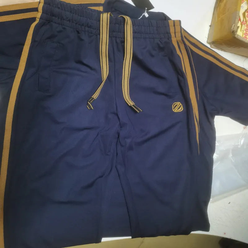 Men's blue short sleeve polyester suit set with matching top and trousers for sports activities