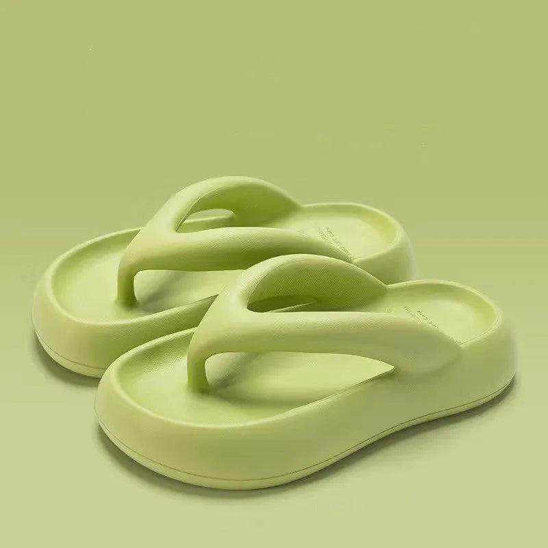 A pair of EVA thick-soled flip-flops with a bow detail on the upper, shown in one of the available colours.