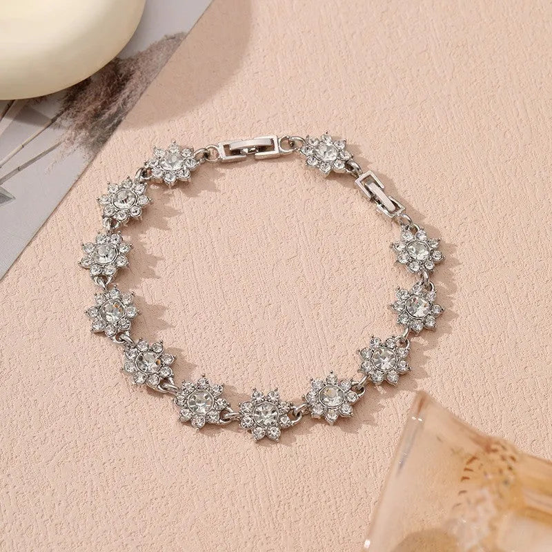 Floral zinc alloy bracelet with electroplated gold or silver finish and gemstone colour variants