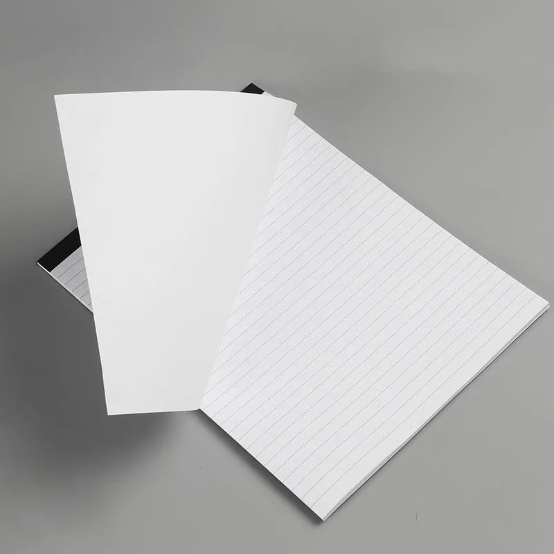A4 tearable grid notebook with paper cover open to show ivory white pages with subtle grid pattern