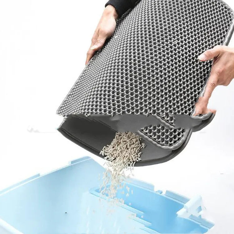 Double-layer EVA cat litter mat in black with honeycomb texture, 1.5cm thick, placed under a litter tray