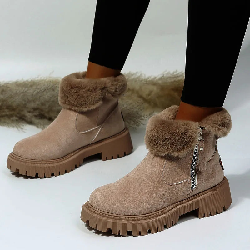Women's black high-top snow boots with a side zipper and faux suede upper on a rubber sole.