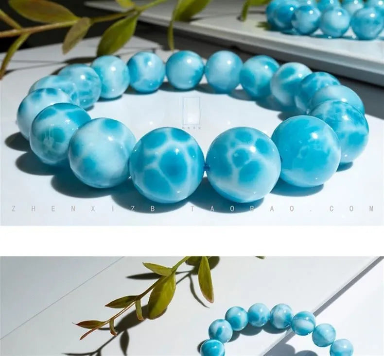 Blue and natural toned handmade bodhi bracelet with sea-pattern stones and pearl elements