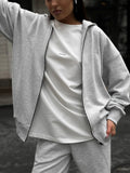 Street style two-piece set featuring long-sleeved coat and matching trousers in loose fit